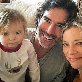 Amy Smart with her husband and daughter